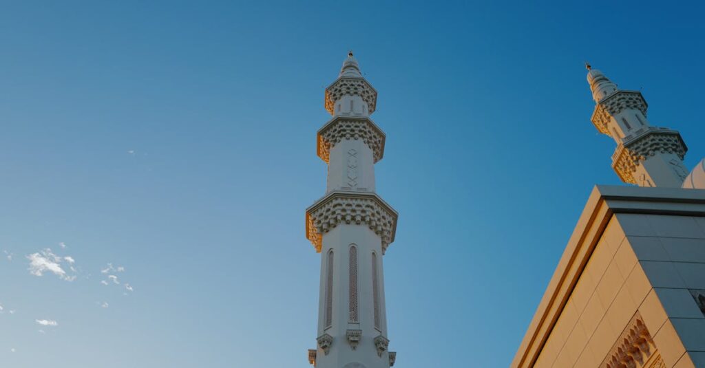 Beautiful minaret of a mosque in Sendayan, Malaysia, under a clear blue sky.
